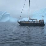 Sailboat passing by icebergs July 14th 2023